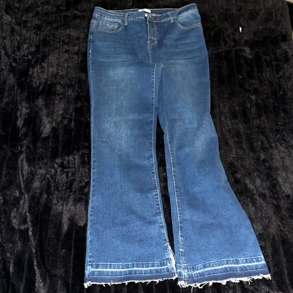 Women's Jeans... wide leg/boot cut. Fringed bottom/ slits.